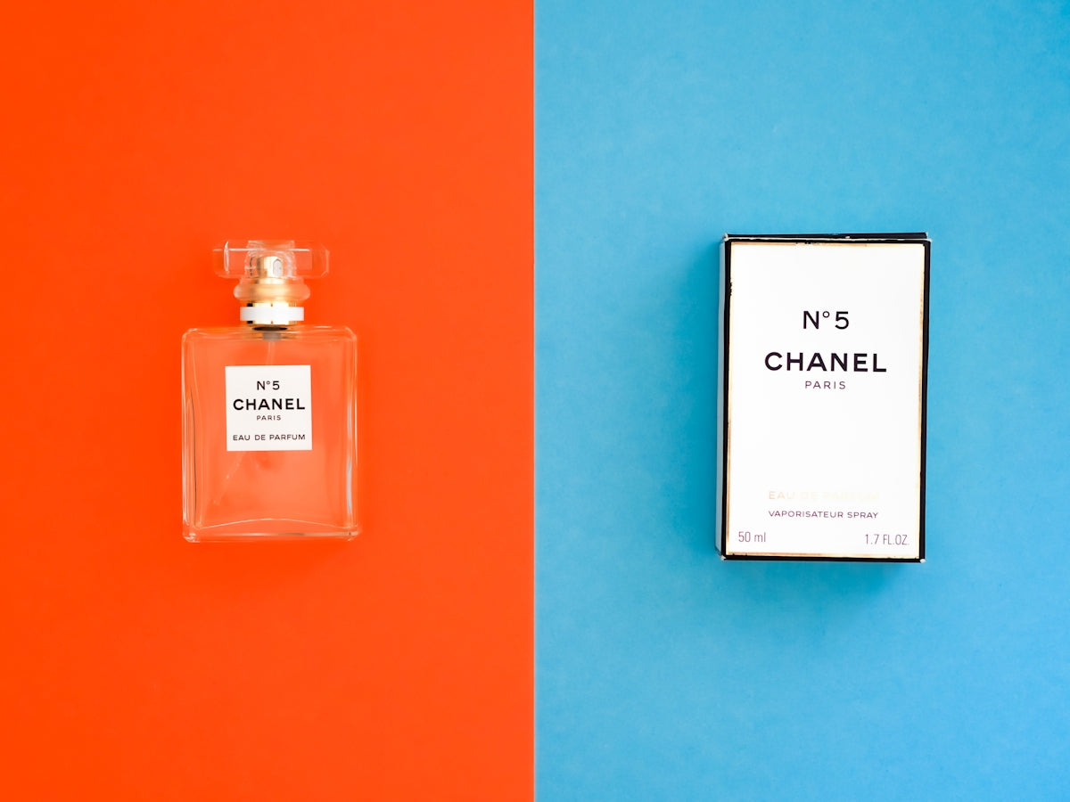 white and black labeled perfume bottle